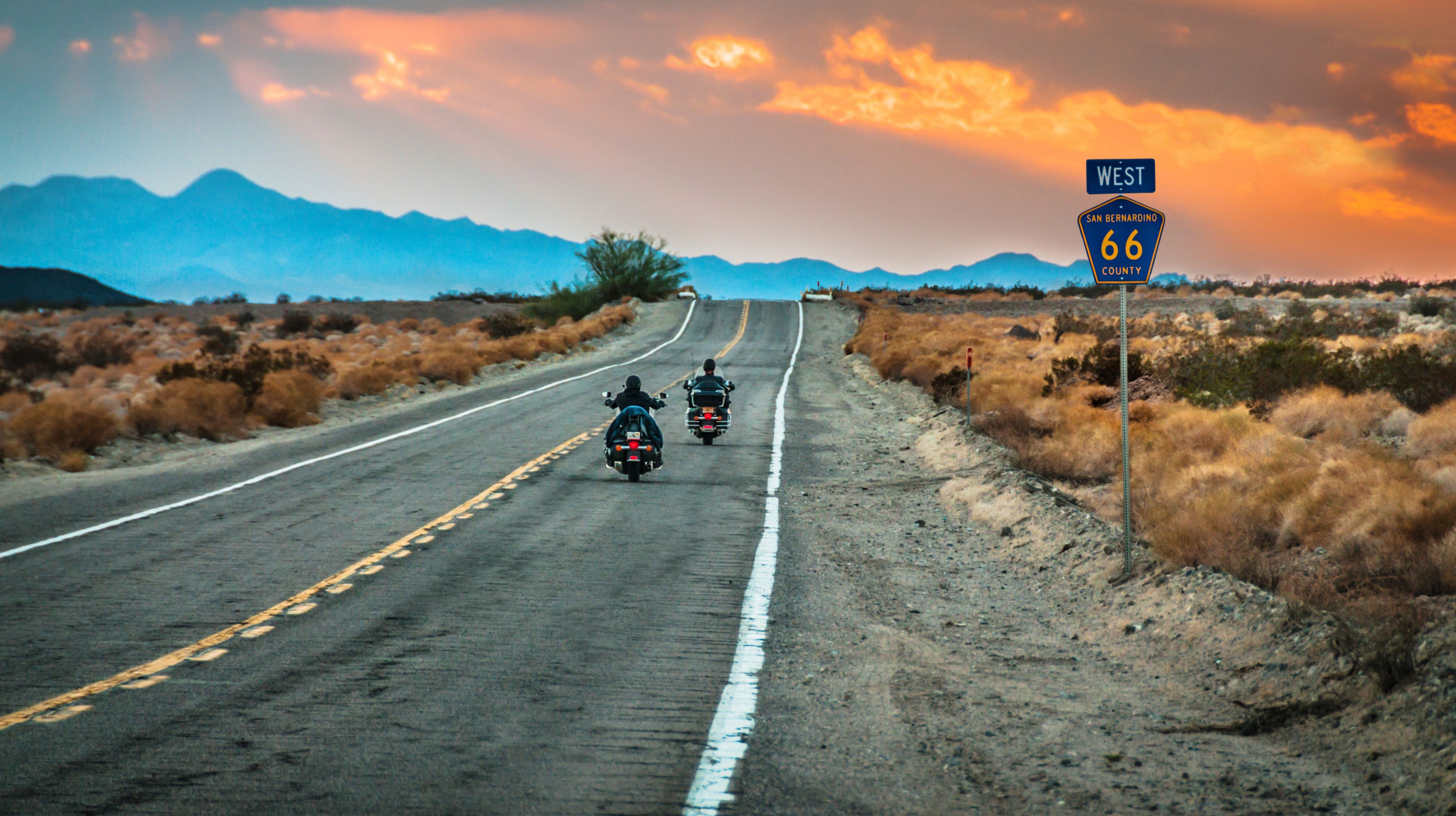Route 66 highway stretching into the distance at sunset